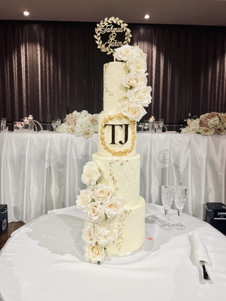 A beautifully lit photo of a wedding cake in Sydney by Blow the Candle, showcasing their artistic style and attention to detail using the finest buttercream.